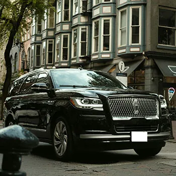 Luxury SUV parked on urban street.